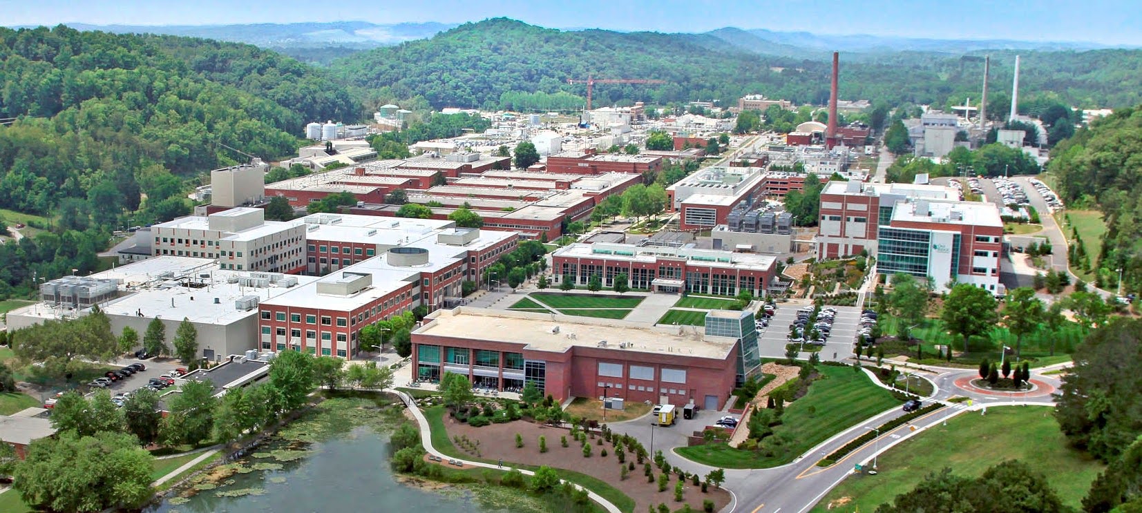 Oak Ridge National Laboratory campus beneath green hills