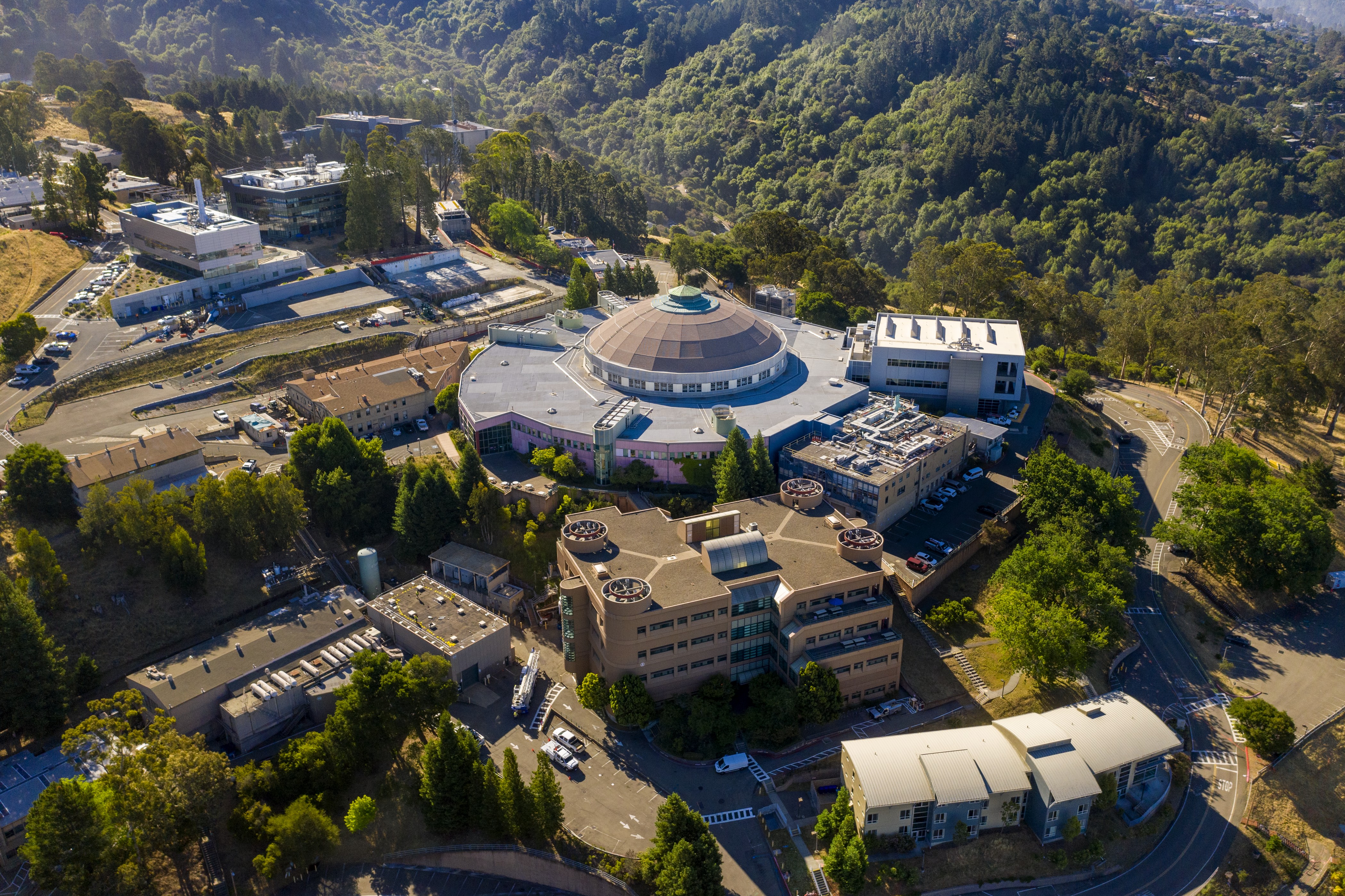 Aerial view of a research facility surrounded by trees